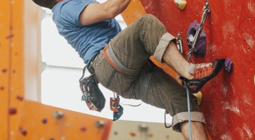 Rock climber on rock climbing wall