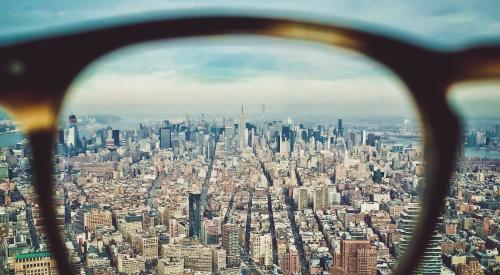 Glasses overlooking cityscape