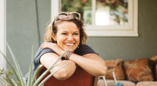 Woman sitting on back patio