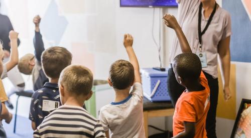 School_children_raising_their_hands