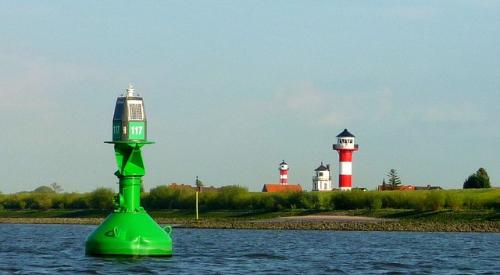 Bouy and light house in harbor