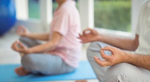 Senior living residents meditating