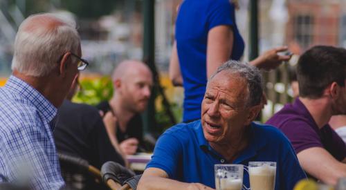 Two seniors sitting at a café