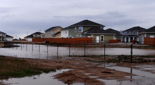 Standing water around new homes after heavy rain