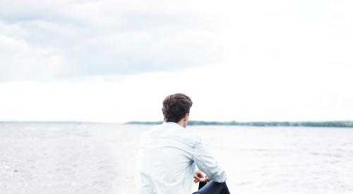 man staring at water