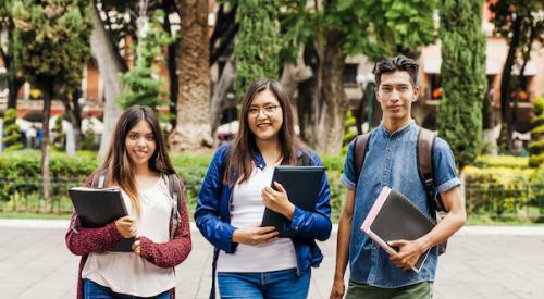 Students holding binders