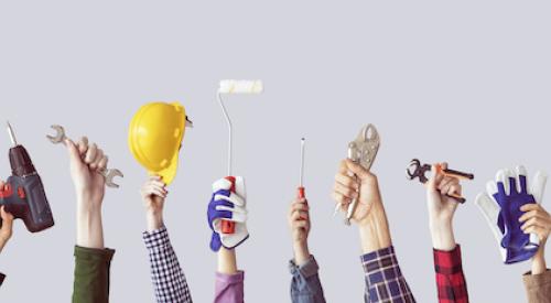 Students holding tools