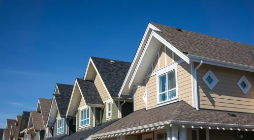 Row of colorful build-to-rent townhouses 