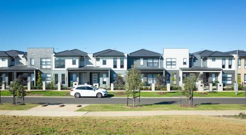 Row of white and gray townhouses on street