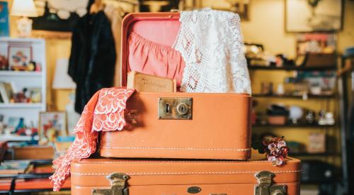 Pink suitcases inside bedroom | Greater price appreciation correlates to higher turnover rates for homeowners, according to new data from LendingTree.