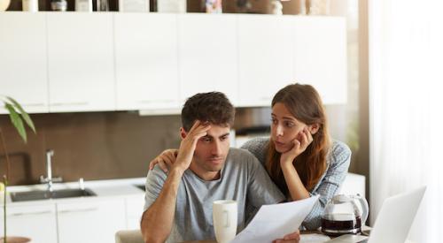 Unhappy Couple Crunching Numbers