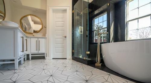 Updated bathroom with new, patterned tile flooring and plenty of natural light