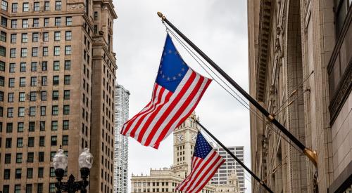 American flags hanging outside of economy building