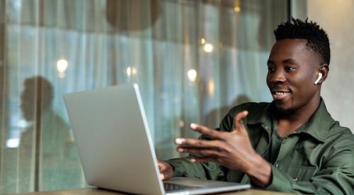 man taking a virtual home tour on his laptop