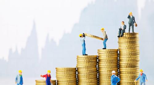 Construction workers on top of stacks of coins