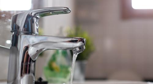 Water streaming from a bathroom faucet