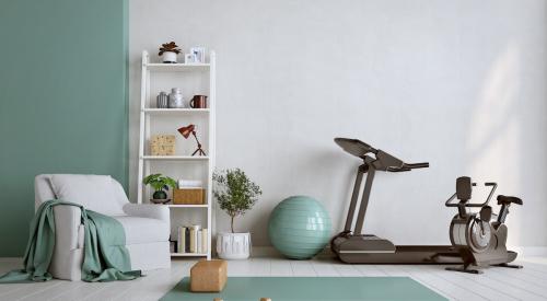 Wellness room with recliner, yoga mat, stationary bike, and exercise ball