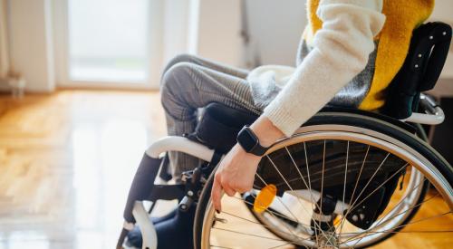 Person in wheelchair in house