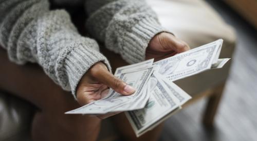 Woman counting cash money