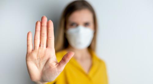 Woman in face mask social distancing