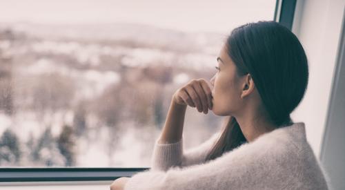 Woman looking out the window