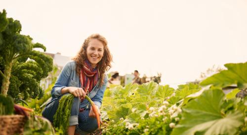 Woman smiling while farming