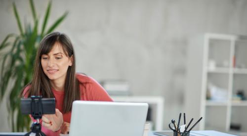 Woman using phone for virtual tour