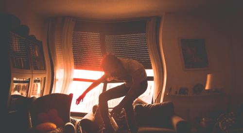 Man in a home with distorted camera view