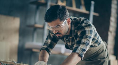 Young man in a wood shop